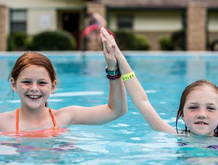 two girls swimming